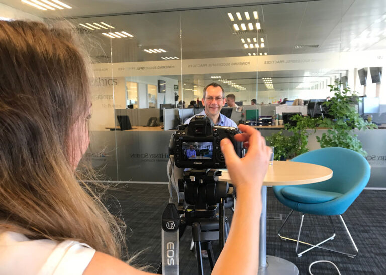 behind the scene of a person doing an interview.