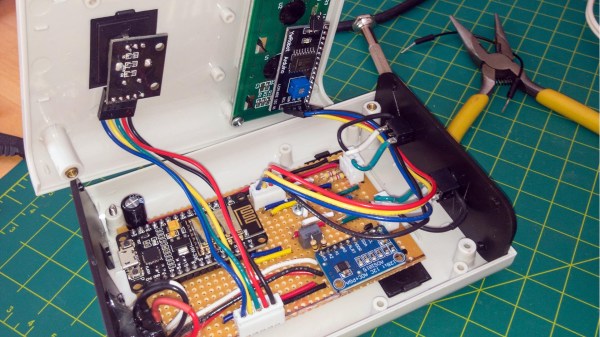 An opened plastic project box with electronics inside