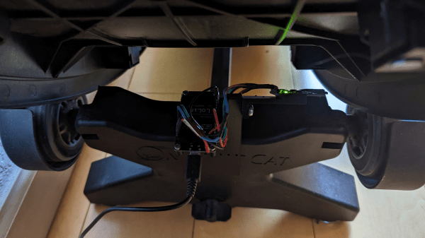 A shot of the underside of a "One Fast Cat" cat wheel with an installed ESP8266 and hall effect sensors attached to the base.