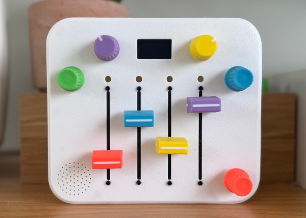 A small, colorful synth built for a 3-year-old. It has five pots, four sliders, and a tiny screen.