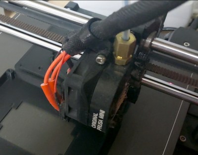 The extruder unit from a Prusa Mini 3D printer