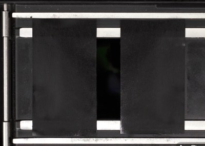 The focal plane of a 35mm camera with tape masking most of the frame