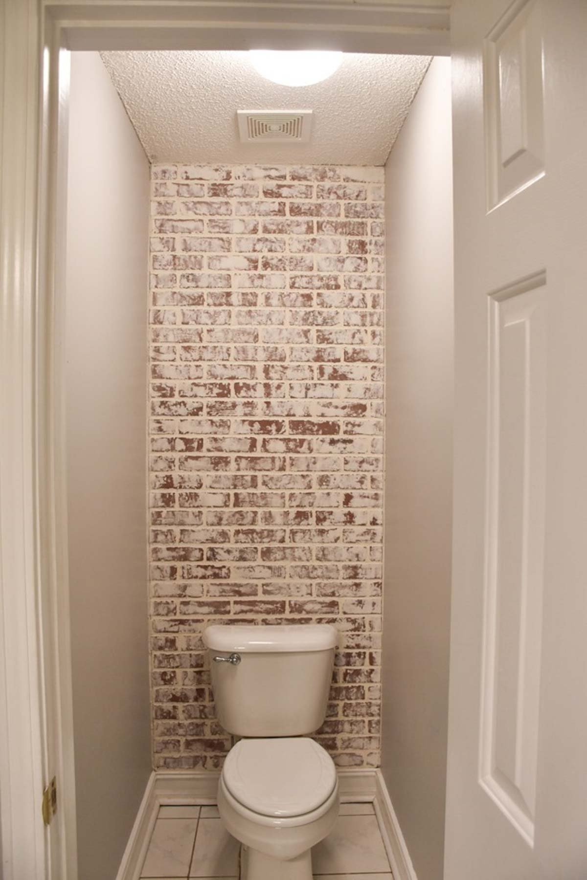 faux brick wall in small bath