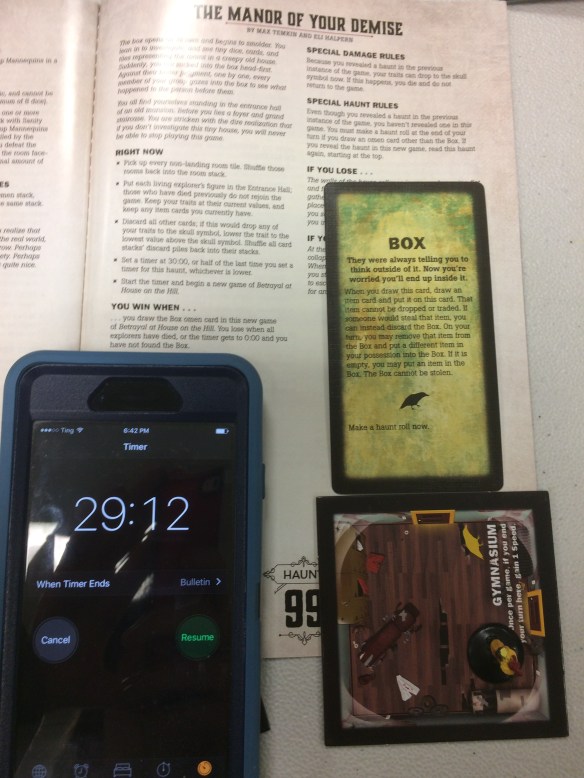 Components of a successfully completed Betrayal at House on the Hill scenario and a smartphone timer reading 29:12.