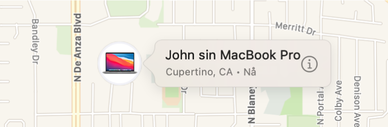 Et nærbilde av Informasjon-symbolet for Johns MacBook Pro.