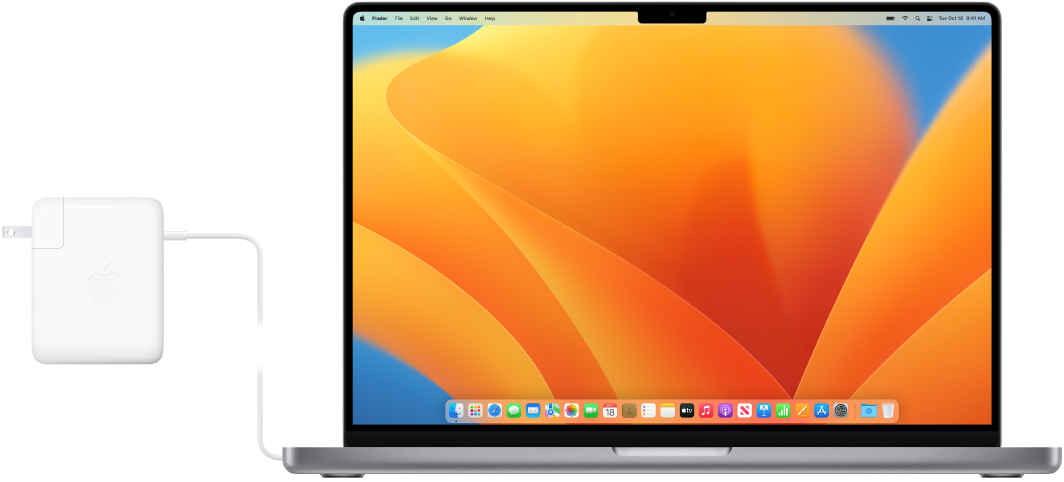 16palcový MacBook Pro s připojeným napájecím adaptérem