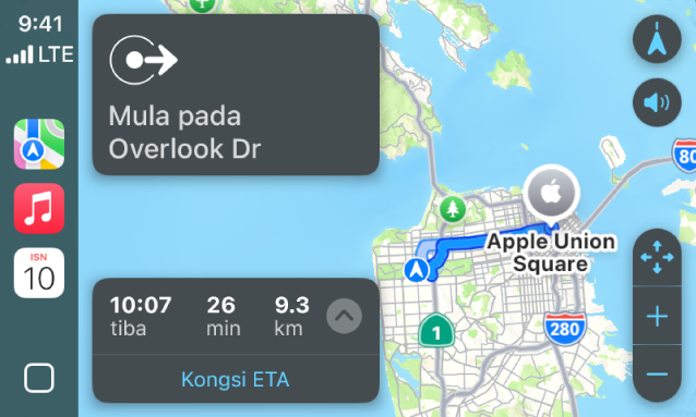 CarPlay menunjukkan Peta, Muzik dan Kalendar dalam Bar Sisi. Di sebelah kanan ialah laluan navigasi daripada Apple Park ke Stesen Apple Union.