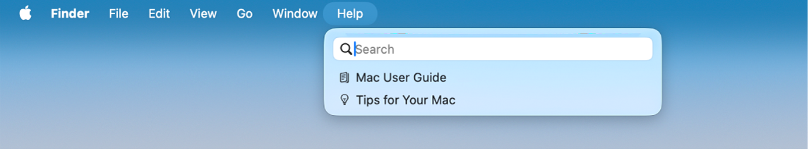 Desktop terpisah dengan menu Bantuan terbuka, menampilkan pilihan menu untuk Cari dan Petunjuk Pengguna Mac.