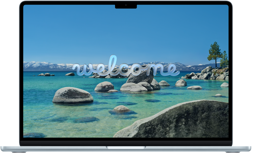 Avatud MacBook Pro, mille ekraanil on kiri “Welcome”.