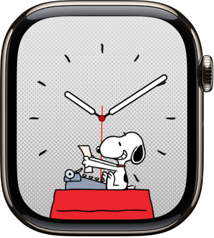 L’esfera Snoopy amb un Snoopy que somriu a una màquina d’escriure.