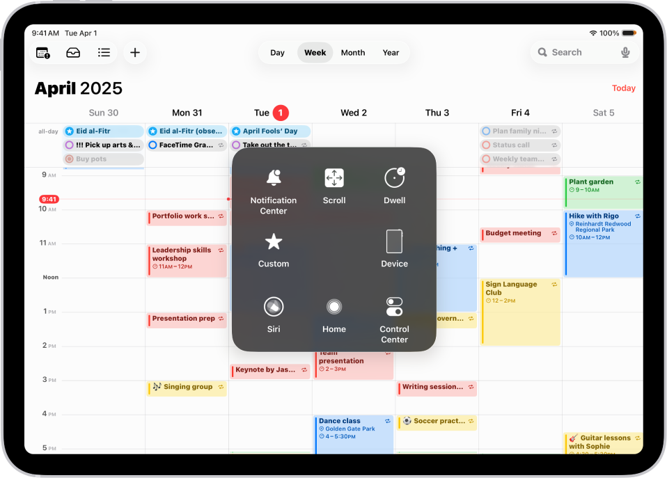 „iPad“ įrenginyje rodomas „AssistiveTouch“ meniu su „Pranešimų centro“, „Įrenginio“, „Valdymo centro“, „Pradžios“, „Siri“ ir „Pasirinktiniu“ valdikliais.