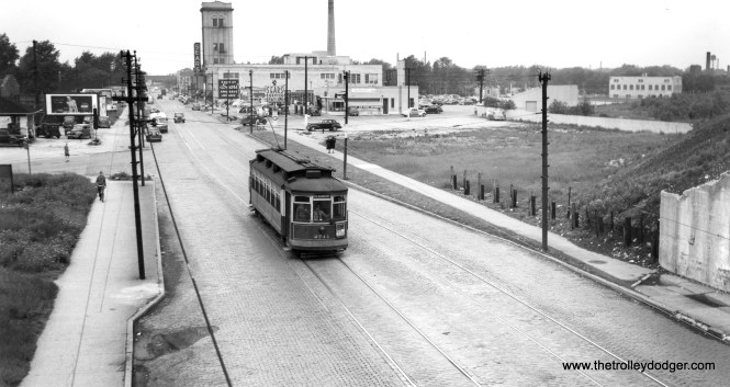 CSL 2744. Bill Shapotkin says we are "looking west on 79th off the PRR (PFtW&C) overpass. (We're near the "other" Six Corners (79th/Stony/South Chicago)). Thus, the large vacant area west of the railroad tracks is the result of land clearing for the Calumet (now Chicago) Skyway and the first street intersection is Anthony." Bob Lalich concurs and adds, "Joe Diaz was on the PRR elevation when he took the photo." Andre Kristopans adds, "The Sears in the background closed in 2013." (Joe L. Diaz Photo)