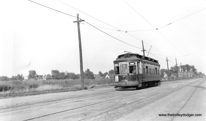 CSL 2802 is westbound on 119th Street. Andre Kristopans says, "a block or so west of Morgan, about where the new Salvation Army center now is. Looks like a State/Lake car in the far background at Morgan."