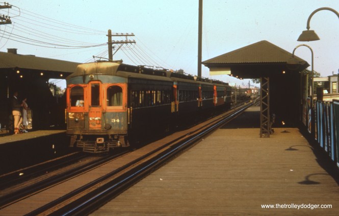 #40 - FH: Nice shot of a five-car rush-hour train of “shorties” at Kedzie, express to Wheaton if the sign is to be believed. The 34 is still in tattered blue and retains its light grey roof, or what’s left of the paint anyway; a lot of cars had their roofs tarred in the late 1940s/early 1950s. It looks like the motorman has drawn the curtain over the “railfan window” in the bulkhead so that the commuters don’t all have the sun in their faces. And it’s tough to tell but it looks like an ex-North Shore wood car in the background on the curve.