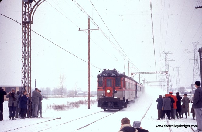 A snowy Skokie Valley Route photo run-by during a North Shore Line fantrip on February 21, 1960.