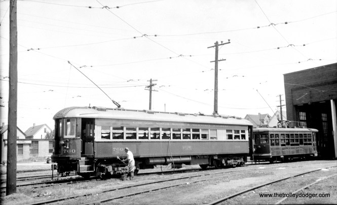CNS&M 760 and a Birney streetcar at Harrison shops in Milwaukee. Looks like the 760 is being cleaned.