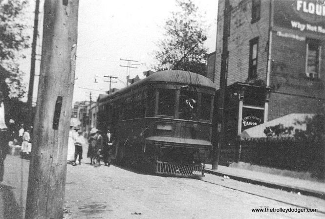 Photo caption: "Penn Central Railway #2 at the end of line (in) South Fork. Note motorman raising trolley to wire from window. These were center door cars. 1918."