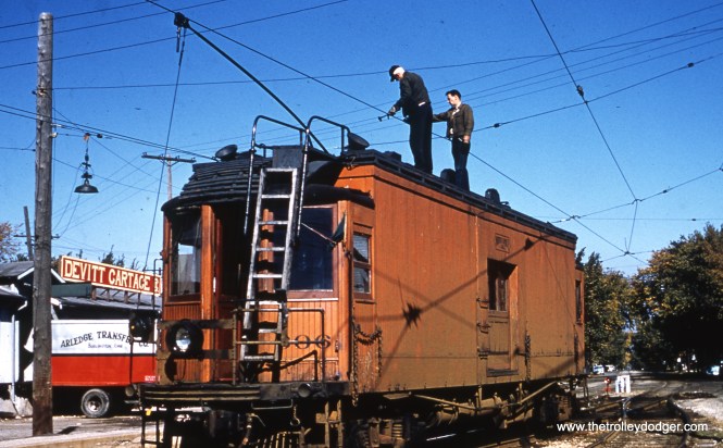 CNS&M line car 606 on October 12, 1961. Don's Rail Photos says, "606 was built by Cincinnati in January 1923, #2620. In 1963 it became Chicago Transit Authority S-606 and burned in 1978. The remains were sold to the Indiana Transportation Museum." Joseph Hazinski writes, "The picture of North Shore Line car 606 is Northbound at Harrison Avenue on the mainline just before entering S. 5th Street. After adjustments are made to the overhead 606 will continue its patrol to the downtown Milwaukee terminal and lunch before returning south to Highwood."