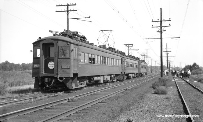 Chicago, South Shore & South Bend car 31 and train at Wilson, Indiana, on an early CERA fantrip (possibly September 20, 1942). Mitch adds, "The photo of the South Shore Line fan trip, 1942 in this episode of “The Trolley Dodger,” appears to be at Power Siding, between Sheridan and the Highway 12 crossing west of Michigan City."