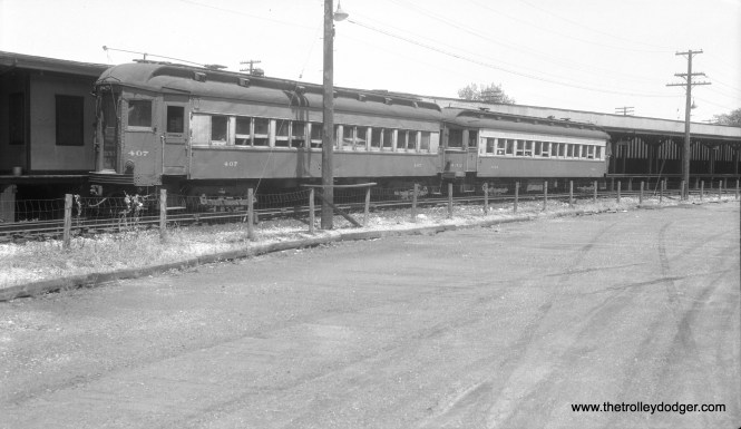 Chicago, Aurora & Elgin cars 407 and 432 at the Forest Park terminal in September 1955. CA&E service was cut back to here two years earlier. 407 was a Pullman, built in 1923, while 432 was a 1927 product of the Cincinnati Car Company. Riders could change here "cross platform" for CTA Garfield Park "L" trains.