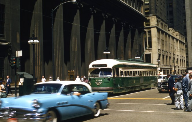 CTA PCC 7184 is southbound on Clark Street on July 9, 1957. I realize that some people might not like this photo, since it is not perfect and part of the streetcar is blocked by a moving vehicle. But such pictures do give you a sense that these were vehicles in motion.
