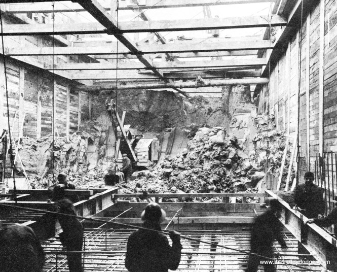 Early "cut and cover" construction near a subway station.
