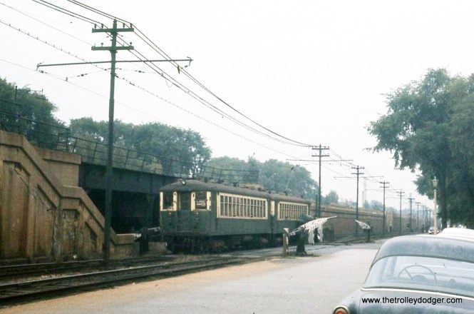 a westbound Lake Street "L" train in Oak Park. That stairway may be where one of the other pictures in this series was taken from. I assume this was located at the east end of the C&NW's Oak Park station.