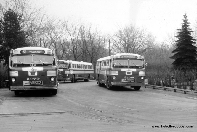 CTA buses 5076 and 5300 at the Imlay loop, at Milwaukee and Devon.