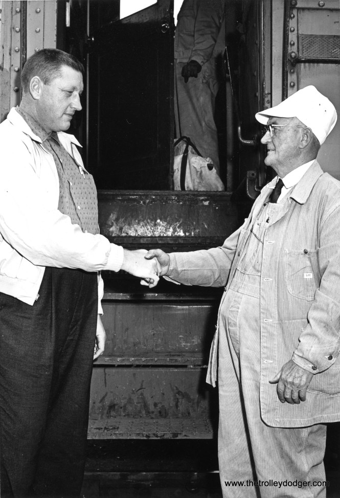 Carl Edward Hedstrom Jr. (1918-2009) congratulating Carl Edward Hedstrom Sr. (1889-1978) on his retirement as a South Shore Line engineer in Michigan City, Indiana on October 30, 1960. Senior worked for the railroad from 1921 to 1960, while Junior also worked as a motorman there from 1939 to 1983. (Michigan City News Dispatch Photo)