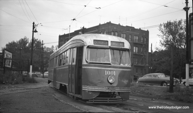 Brooklyn and Queens Transit PCC 1001 is at the Bristol Street loop on line 35 - Church on May 30, 1956. The auto at right is in the "bathtub" style that was briefly popular around 1950.