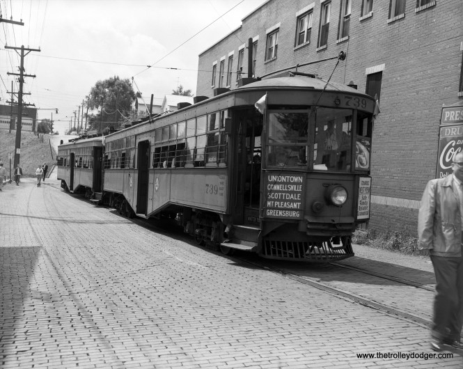 West Penn Railways car 739 is on a fantrip at an unknown time. Interestingly, the car survives. After being used as a residence, after retirement in 1952, it ended up at the Pennsylvania Trolley Museum, where it is being restored. Larry Lovejoy adds: "The photo of West Penn Railways 739 is northbound at Mt. Pleasant, on Center Avenue, just about to cross West Main Street, the latter which is now Pennsylvania Route 31 but back then had a different highway number. The date is August 10, 1952 and this is an “after the last day” fantrip charter by the Pittsburgh Electric Railway Club. PERC was the direct corporate predecessor of Pennsylvania Trolley Museum. The car behind 739 is the 733. Sorry I can’t identify any of the recognizable faces."