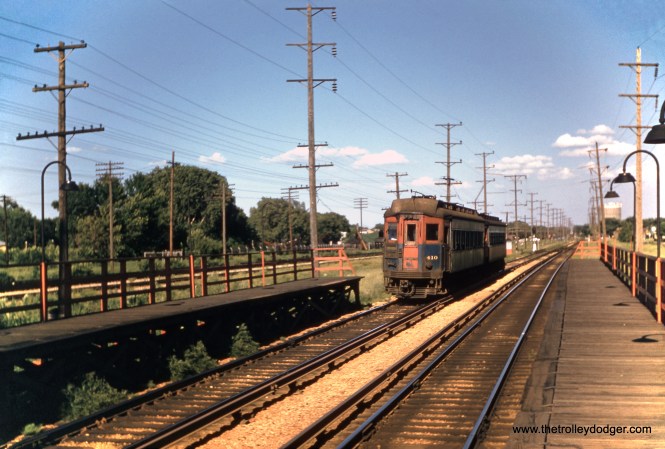Chicago Aurora and Elgin 410 heads up a westbound two-car train at the 25th Avenue station in Bellwood on June 29, 1957. (Robert D. Heinlein Photo)