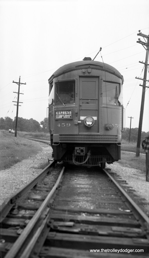 On August 8, 1954, photographer Robert A. Selle took this picture of Chicago Aurora and Elgin car 459 during a fantrip photo stop on the Elgin branch. The event was a Central Electric Railfans' Association excursion. When the time comes to submit potential cover images for my next book, this could be among them. When we worked on my last book, I had to submit six different images, and then we chose the one that worked best. Although the sign says "St. Charles - Geneva," that branch of the CA&E had last run in 1937, but as Bob Bresse-Rodenkirk notes, "Elgin branch trains connected at Lakewood after 1937 for CA&E buses to St. Charles and Geneva." Michael Crist thinks we are "sitting on the Milwaukee Road interchange track just east of Raymond Street, Elgin."