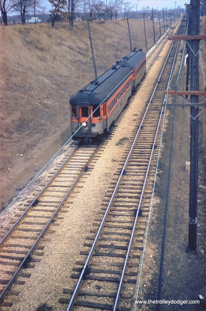 Silverliner 742 is at the head of a two-car train in March 1961. Might this be in Wisconsin? (David Church collection) Nick Jenkins writes: "I believe the photo was taken from Howard Ave overpass in Milwaukee. The spur in the background would be the Austin Ave Team Track. The little green dot (in the trees) would be Sig 813 and the bridge over the Milwaukee Road is barely visible at the top edge of the photo."