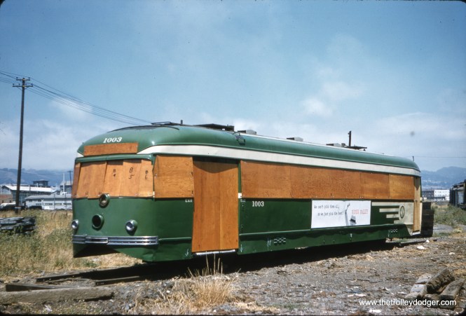 Subject: SF Muni Magic Carpet #1003 Location: San Francisco, CA Date: June 13, 1960 Photographer: Clark Frazier San Francisco's "Magic Carpets" 1001-1005 were double-ended streetcars, similar to PCCs but with somewhat different components, built in 1939 for the Municipal Railway. They were used in service until 1959. #1003, seen here, was the only survivor and it went to the Western Railway Museum, where it is today. Here it is shown prepared for the move.