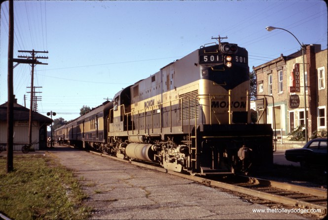 Monon Railroad "The Thoroughbred" Location: Mitchell, Indiana Date: August 25, 1967 Photographer: Tom Smart The Thoroughbred was a streamlined passenger train operated by the Chicago, Indianapolis and Louisville Railway (Monon) between Chicago, Illinois and Louisville, Kentucky via Monon, Indiana. It operated from 1948 to 1967. The Thoroughbred was the last passenger train operated by the Monon. It was named for the Thoroughbred horse breeds, a nod to the horse racing heritage of Louisville. Following World War II new Monon president John W. Barriger III embarked on a program to renew the Monon's passenger service, long neglected. The centerpiece of this program was a group of 28 surplus hospital cars originally built by the American Car and Foundry Company (ACF) in 1944–1945 for the U.S. Army. The Monon rebuilt these cars in their shops, creating enough lightweight coaches, parlor-observation cars, dining cars and mail/baggage cars to create three new streamliners: the Chicago-Indianapolis Hoosier and Tippecanoe, and the Chicago-Louisville Thoroughbred. The Thoroughbred made its first run on February 15, 1948, replacing the Day Express. Monon discontinued the Thoroughbred on September 30, 1967. It was the final passenger service on the Monon, although Amtrak's Hoosier State utilized part of Monon's route between Indianapolis and Chicago.