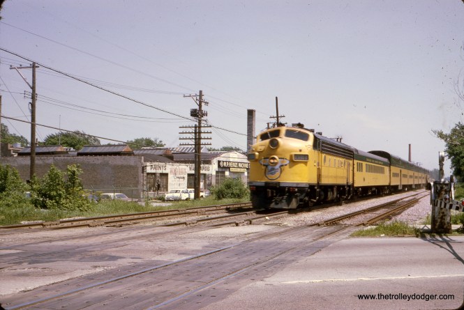 CNW Chicago & North Western Diesel Commuter Location: Unknown Date: November 1966 (processing date) Photographer: Unknown Miles Beitler: "I believe the Chicago & North Western commuter train in photo eba994 is on the C&NW Northwest Line at Edison Park (near Devon Avenue and Northwest Highway) on Chicago’s far northwest side." Patrick J. Cunningham: "M.P. Heinze Machine Co. looks to have been at 6300 Northwest Highway, so that picture may have been taken from the Harlem Ave. grade crossing." Matt Cajda: "I second this opinion. I grew up in this area and it looks like Harlem Ave. at Avondale. We would be looking southeast towards the Norwood Park station but it is not visible behind the train."