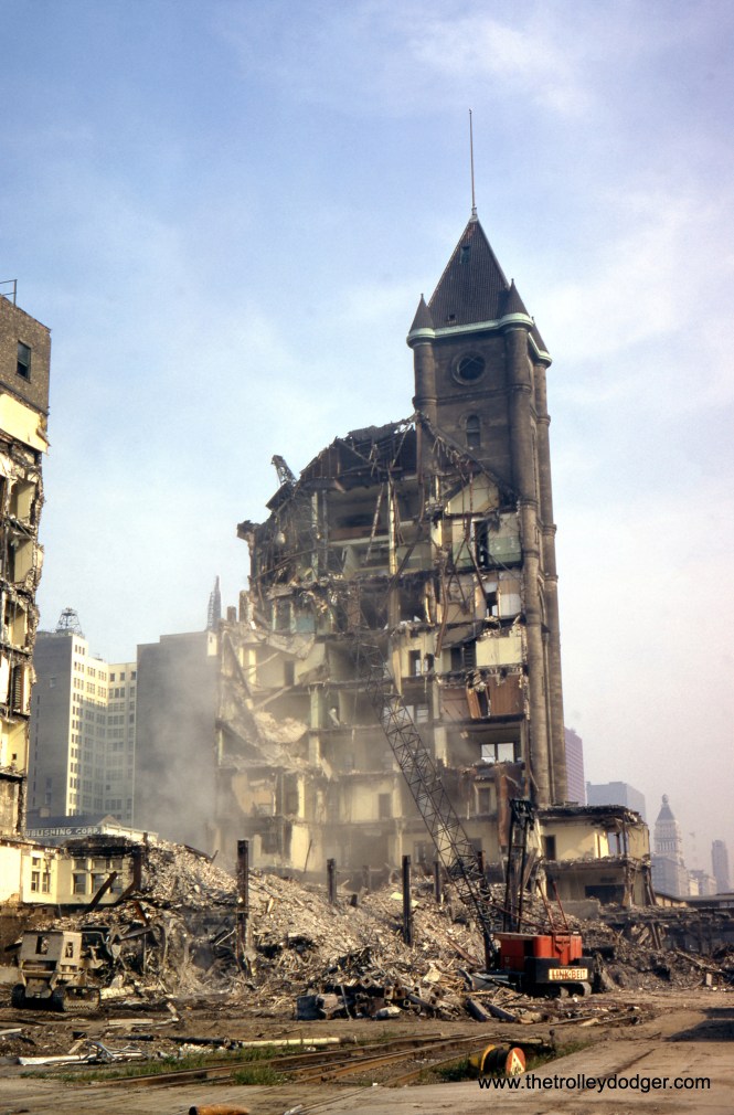 Subject: Illinois Central Station Demolition Chicago 1974 Location: Chicago, Illinois Date: November 1974 (processing date) Photographer: Unknown From the Wikipedia: Central Station was an intercity passenger terminal in downtown Chicago, Illinois, at the southern end of Grant Park near Roosevelt Road and Michigan Avenue. Owned by the Illinois Central Railroad, it also served other companies via trackage rights. It opened in 1893, replacing Great Central Station (on the site of the current Millennium Station), and closed in 1972 when Amtrak rerouted services to Union Station. The station building was demolished in 1974. It is now the site of a redevelopment called Central Station, Chicago. Adjoining platforms at Roosevelt served the Illinois Central's suburban trains for both the Electric and West lines, in addition to the South Shore Line interurban railroad. All three lines continued north to Randolph Street.
