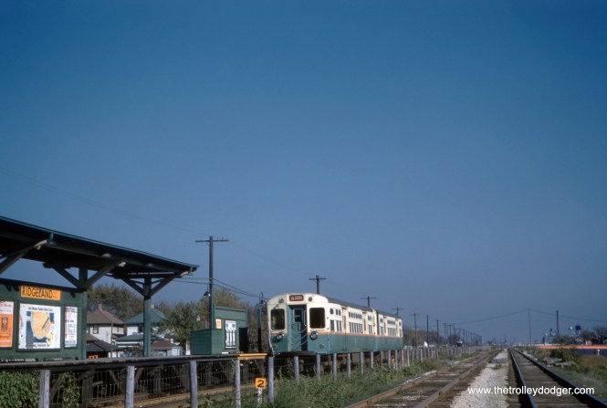Oak Park residents may be surprised to know there was once an "L" station at Ridgeland Avenue on what is today the CTA Blue Line. But it was short-lived, only open from September 1957 until March 1960. This slide was processed in November 1959. The Garfield Park "L" previously had a station at Gunderson Avenue, a side street a few blocks west of here. It was on a side street because that's where some new homes were built by a developer named Gunderson at the turn of the century. The CTA originally planned a permanent station here, but opted for secondary entrances to the stations at Austin (Lombard) and Oak Park Avenue (East Avenue) instead. You can see the bridge that crosses the highway at Austin Avenue under construction in the distance. (Jeffrey L. Wien Photo)