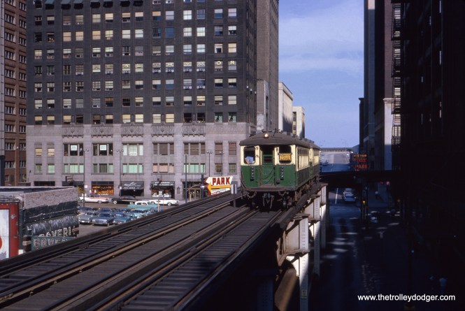 In September 1962, a two-car Lake Street train heads west along the Loop "L" tracks, having just turned from Wabash onto Lake. At this time, trains operated in the same direction (counterclockwise) on both tracks. (Charles L. Tauscher Photo)