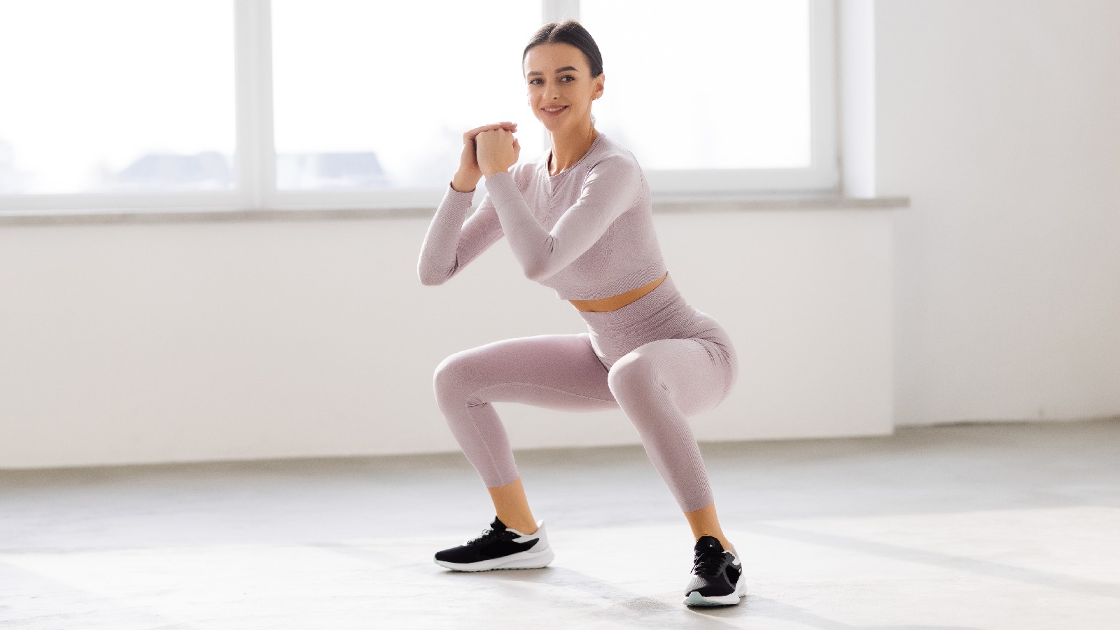 Woman performs squats