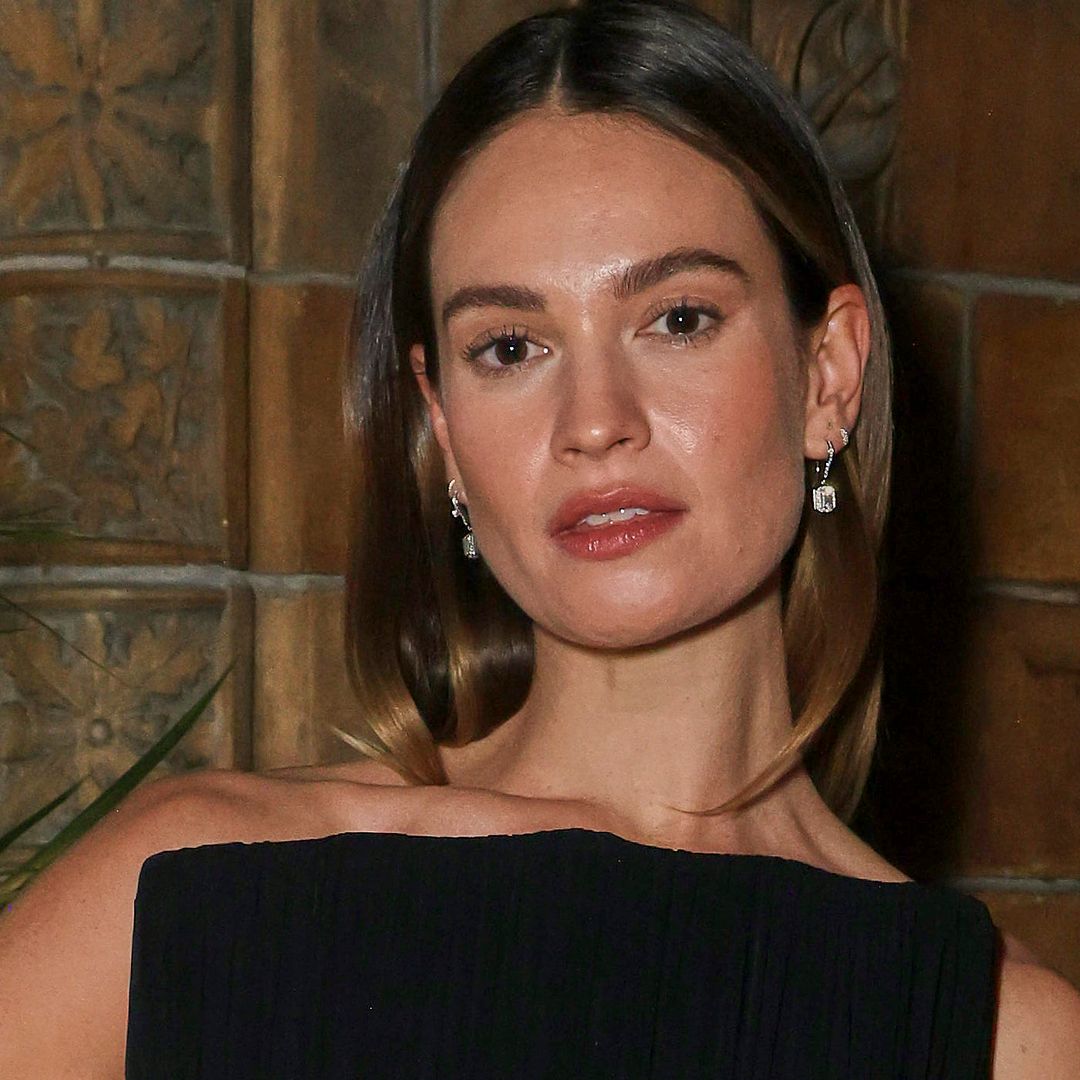 Lily James shows off tattoo in ravishing strapless gown with thigh-high split
