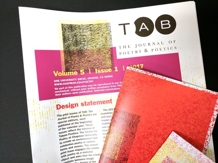 Printed final piece with biggest booklet in the back and medium and small booklets laying on top at an angle.