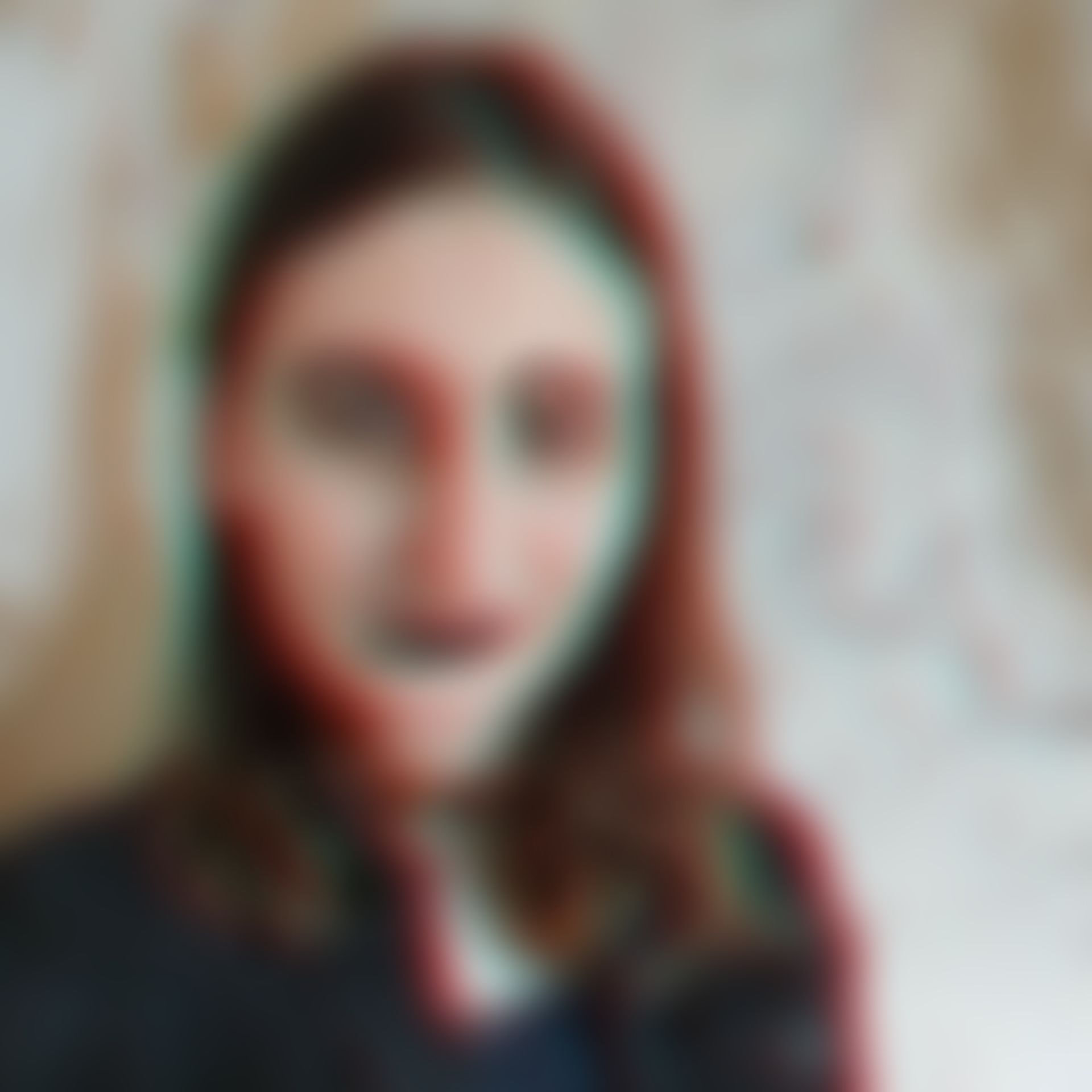 a color distorted, blurry photo of something shaped like a white human, with brunette hair to shoulders a color distorted, blurry photo of something shaped like a white human, with brunette hair to shoulders