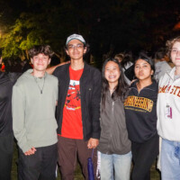 A group of first-year students smiling for a photo wearing sweaters that read 'ENGINEERING' and 'MCMASTER'.
