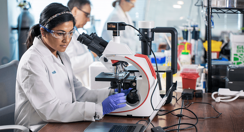 woman using a microscope