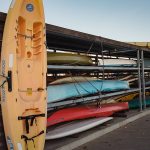 Used kayaks stored on racks