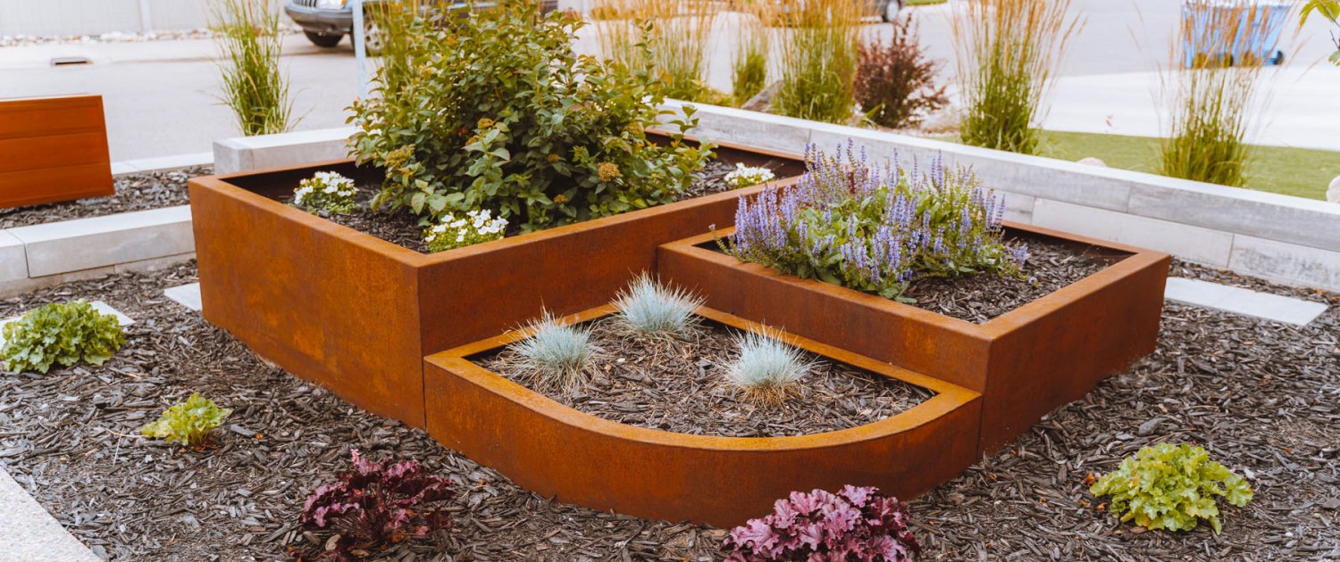 Custom Planter Steel raised planters for planting shrubs and trees in your yard when landscaping