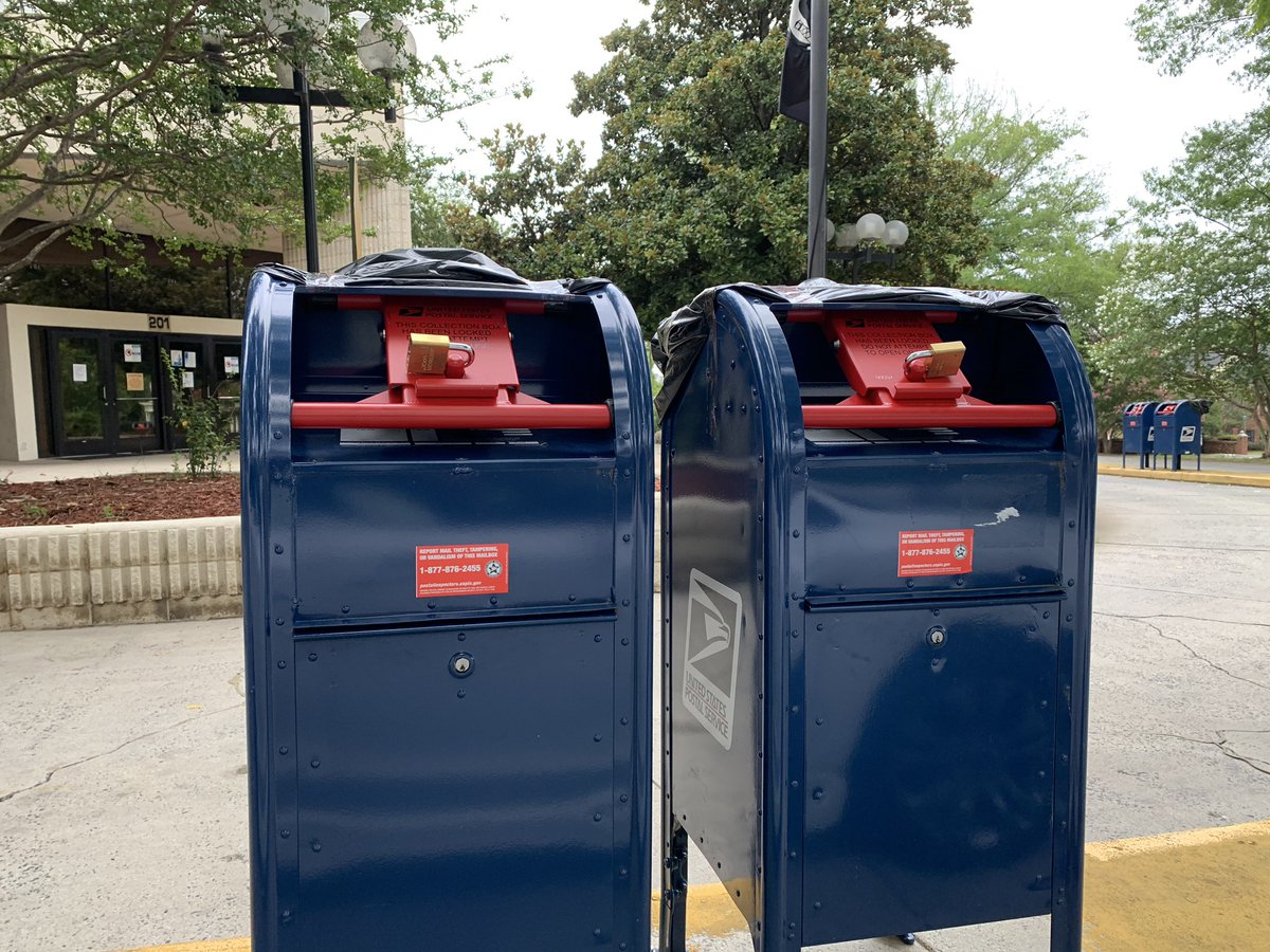 Two more blue post office boxes with red locks