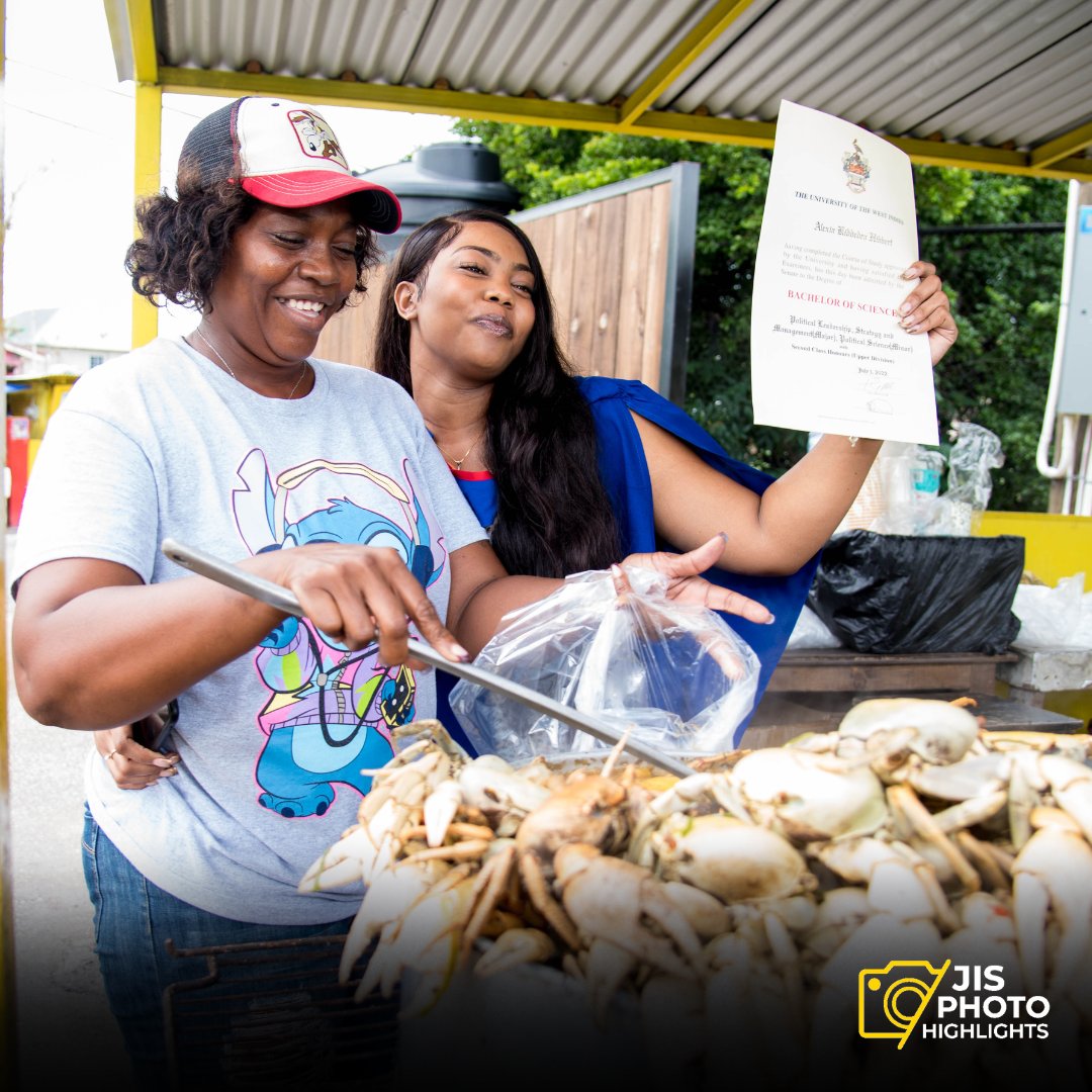 UWI Mona grad, Alexia Hibbert, proudly displaying her BSc in Political Leadership to her mother, Munchie Walker, on Tuesday